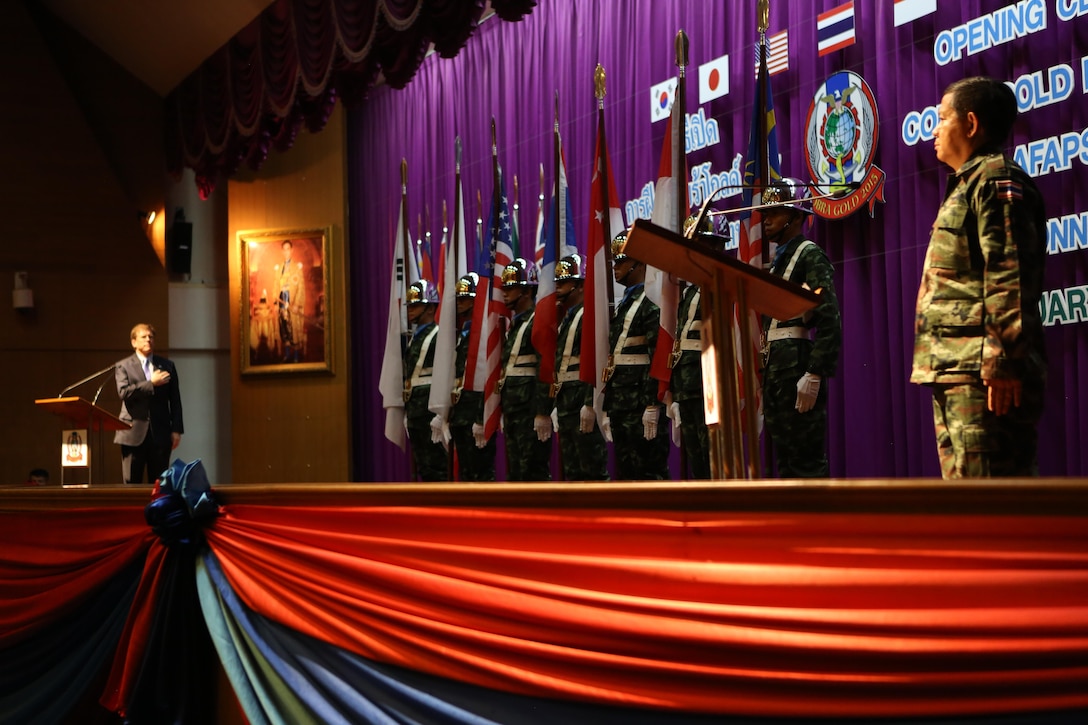 W. Patrick Murphy, Chargé d’affaires ad interim at U.S. Mission Thailand, left, and Gen. Wuttinun Leelayudth, Deputy Chief of Defense Forces for Thailand, stand at attention while the U.S. and Thai national anthems are played during the Cobra Gold 15 opening ceremony at the Armed Forces Academy Preparatory School in Nakhon Nayok, Thailand, on Feb. 9, 2015. Exercise Cobra Gold provides a platform for participating partner militaries to promote regional prosperity, security and cooperation among participating nations, which include Thailand, the U.S., Singapore, Japan, Republic of Korea, Indonesia, Malaysia, India and the People’s Republic of China as well as observers from other countries in the Pacific. (U.S. Marine Corps photo by Cpl. Christopher J. Moore/Released)