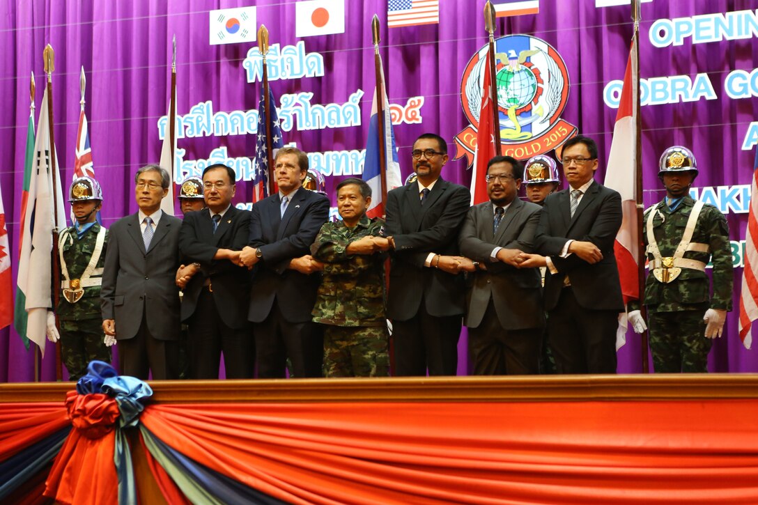 Representatives of participating countries link hands during the Cobra Gold 15 opening ceremony at the Armed Forces Academy Preparatory School in Nakhon Nayok, Thailand, on Feb. 9, 2015. Exercise Cobra Gold provides a platform for participating partner militaries to promote regional prosperity, security and cooperation among participating nations, which include Thailand, the U.S., Singapore, Japan, Republic of Korea, Indonesia, Malaysia, India and the People’s Republic of China as well as observers from other countries in the Pacific.