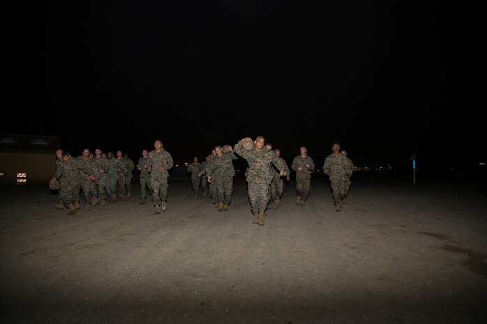 Marines of Support Battalion utilize different techniques to carry their log during the log race at Marine Corps Recruit Depot San Diego, Jan. 21.  Each team used their physical and mental strength to push their minds past the exhaustion and pain of carrying the 150 to 200 pound logs.  