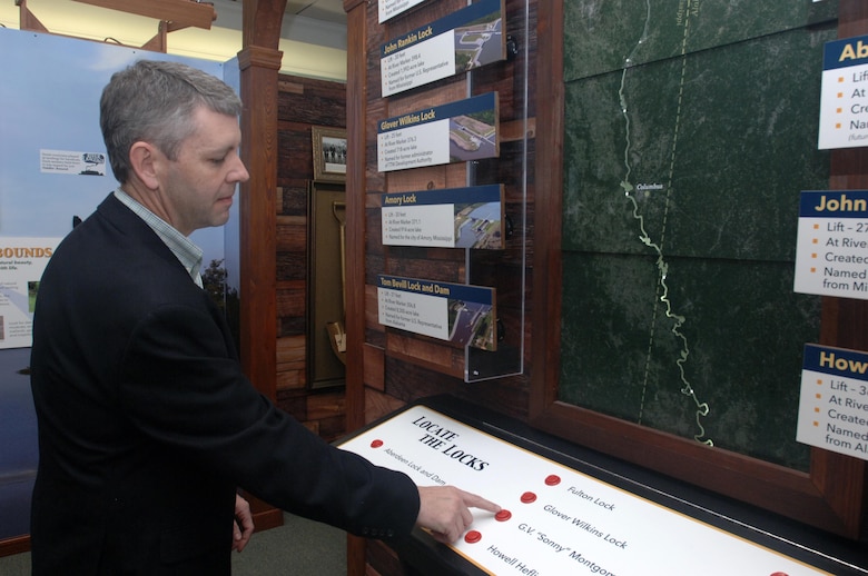 Travis Wampler, Mississippi Department of Transportation, checks out a display that shows the location of each lock within the Tennessee-Tombigbee Waterway as he toured the Tennessee-Tombigbee Waterway Transportation Museum during its dedication in Columbus, Miss., Feb. 6, 2015.