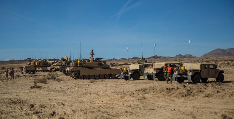 Company D brings  vehicles into formation Jan. 2 before the Tank Mechanized Assault Course at Marine Air Ground Combat Center Twentynine Palms during Integrated Training Exercise 2-15. The TMAC is an assault on multiple objectives using different elements of the Marine Air-Ground Task Force. ITX 2-15 incorporates different scenarios to allow all of the elements of a MAGTF to work together. The Marines are with Company D, 1st Tank Battalion, 1st Marine Division, I Marine Expeditionary Force. 