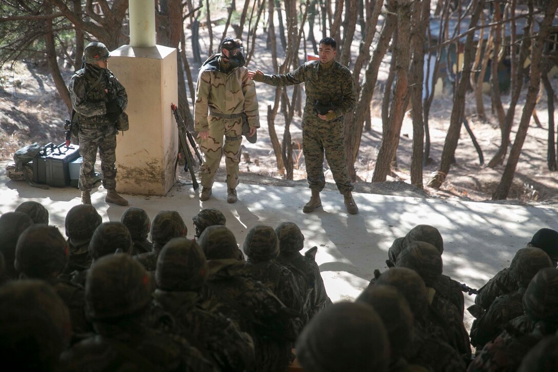 U.S. Marine Sgt. Byron M. Solano, right, teaches ROK Marines about the U.S. Marines’ chemical, biological, radiological and nuclear defense capabilities  during Korean Marine Exchange Program 15-17 Feb. 9 at the Cham Sae Mi Close-Quarters Battle Training Facility, Pohang, Republic of Korea. This training allowed the Marines to exchange knowledge on each other’s CBRN defense capabilities. KMEP is a regularly-scheduled, bilateral, small-unit training exercise, which enhances the combat readiness and interoperability of ROK and U.S. Marine Corps forces. Solano, a Reno, Nevada, native, is the CBRN chief for 3rd Battalion, 3rd Marine Regiment, currently assigned to 4th Marine Regiment, 3rd Marine Division, III Marine Expeditionary Force under the unit deployment program.