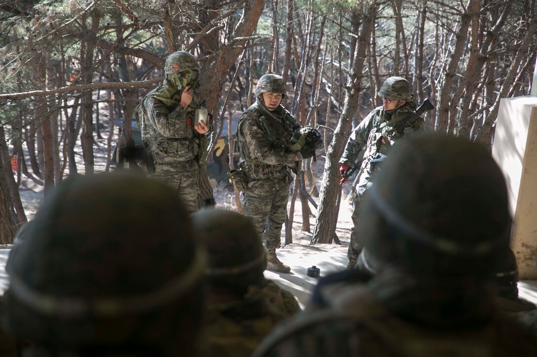 Republic of Korea Marines show their chemical, biological, radiological and nuclear protective equipment to U.S. Marines during Korean Marine Exchange Program 15-17 Feb. 9 at the Cham Sae Mi Close-Quarters Battle Training Facility, Pohang, Republic of Korea. This training allowed the Marines to exchange knowledge on each other’s CBRN defense capabilities. The overarching goal of KMEP is to enhance and improve the interoperability of ROK and U.S. Marine Corps forces. The ROK Marines are with Company 5, 32nd Battalion, 1st ROK Marine Division. The U.S. Marines are with Company I, 3rd Battalion, 3rd Marine Regiment, currently assigned to 4th Marine Regiment, 3rd Marine Division, III Marine Expeditionary Force under the unit deployment program.