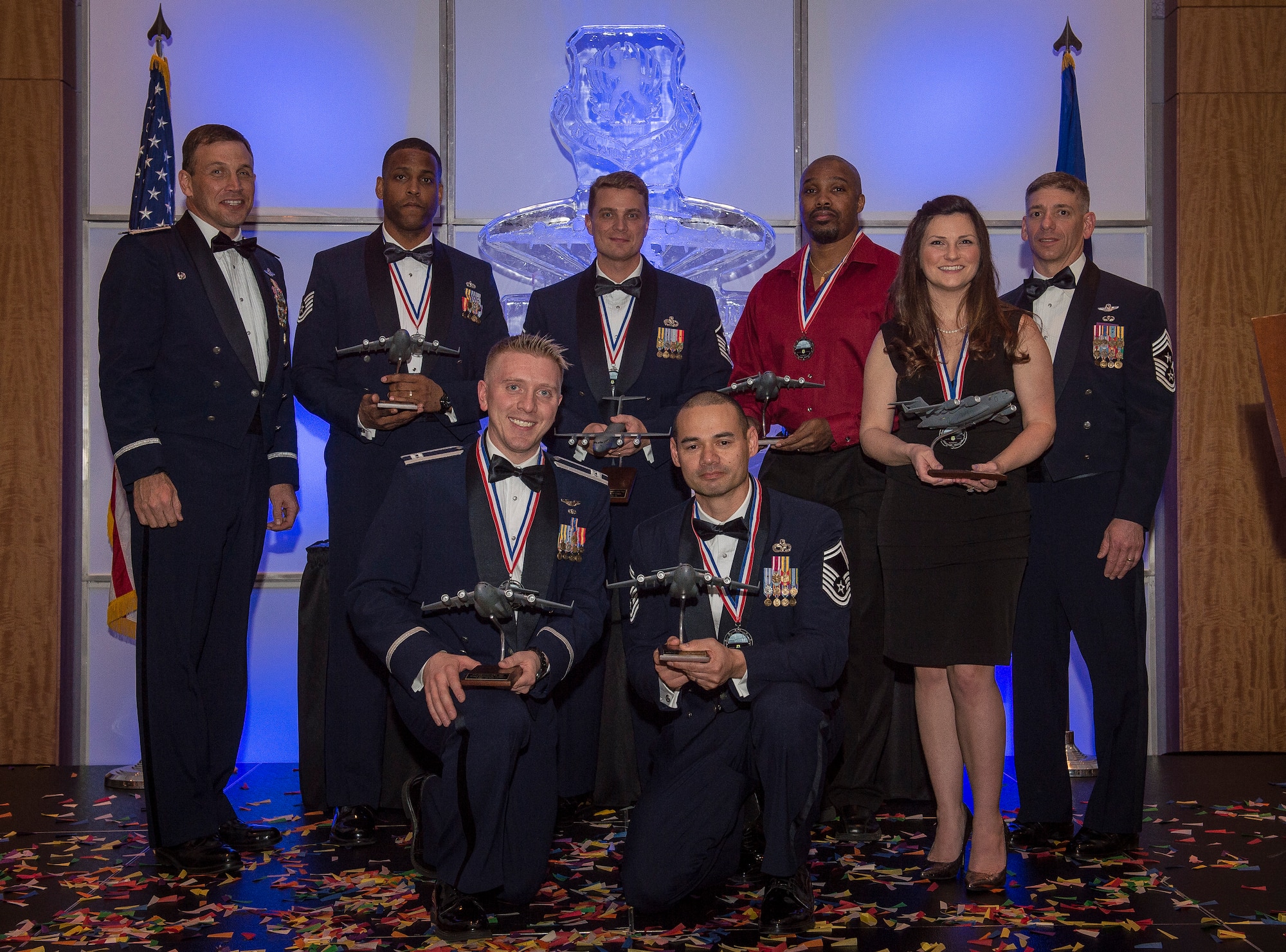 Col. John Lamontagne, 437th Airlift Wing commander, and Chief Master Sgt. Shawn Hughes, 437th AW command chief, recognize the annual award winners at the 2014 437th Airlift Wing Annual Awards ceremony held Feb. 6, 2015. The annual award winners are: Airman of the year, Senior Airman Stephanie A. Lucas, Noncommissioned Officer of the year, Tech. Sgt. Chelce T. Green, First Sergeant of the year, Master Sgt. Mark O’Brien, Senior Noncommissioned Officer of the year, Senior Master Sgt. Bryan T. Whitley, Company Grade Officer of the year, Capt. Daniel A. Naske, Civilian Cat I of the year, Virgil Parks, Civilian Cat II of the year, Gary Wettengel, Key Spouse of year, Molly F.B. Wood. (U.S. Air Force photo/ Senior Airman Dennis Sloan)
