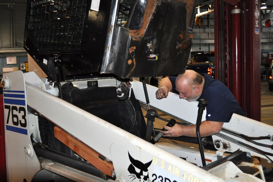 Rick Lord, 66th Logistics Readiness Squadron mechanic, repairs snow removal equipment at the motor pool during the latest round of snow to hit the region, Feb. 9. LRS mechanics have been working long shifts since Jan. 24 to ensure snow removal equipment is operating optimally and safely for snow removal operations. The mechanics sustain a wide variety of equipment, from large ten wheeled dump-trucks to six passenger 4 x 4 pick-up trucks both equipped with plow blades, and large four cubic yard front-end loaders to multi-purpose sidewalk cleaners. (Courtesy photo)