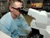 Senior Airman Nicholas O’Neil, 22nd Medical Support Squadron laboratory technician, uses a microscope to look at a red blood cell sample, Feb. 9, at McConnell Air Force Base, Kan. Laboratory technicians examine red blood cells for irregularities in size and shape which may indicate anemia, sickle cell disease or malaria. (U.S. Air Force photo by Airman 1st Class Tara Fadenrecht) 