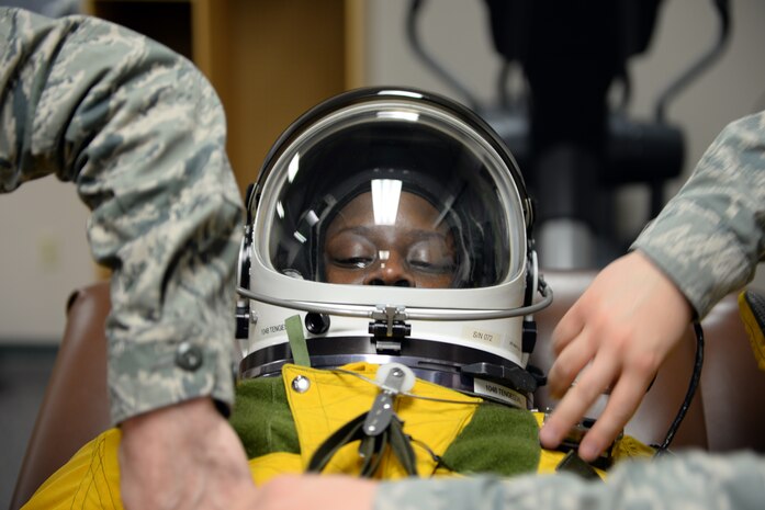 Lt. Col. Merryl Tengesdal, 9th Reconnaissance Wing inspector general and U-2 Dragon Lady pilot, receives pre-flight maintenance on her full pressure suit Feb. 9, 2015, at Beale Air Force Base, Calif. Tengesdal is the only black female U-2 pilot in history. (U.S. Air Force photo by Senior Airman Bobby Cummings/Released)