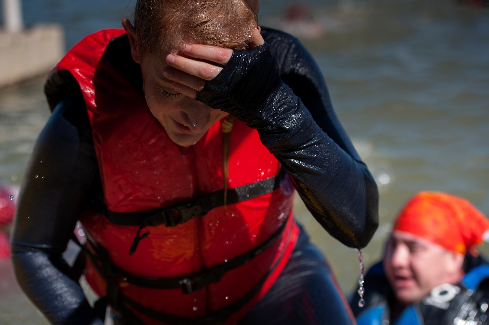 SAN ANGELO, Texas – A Goodfellow Air Force Base member climbs out of Lake Nasworthy during the 13th Annual Polar Bear Swim at the Goodfellow Recreation Camp Feb. 7. The event had over 120 participants this year. (U.S. Air Force photo/ Airman 1st Class Devin Boyer)