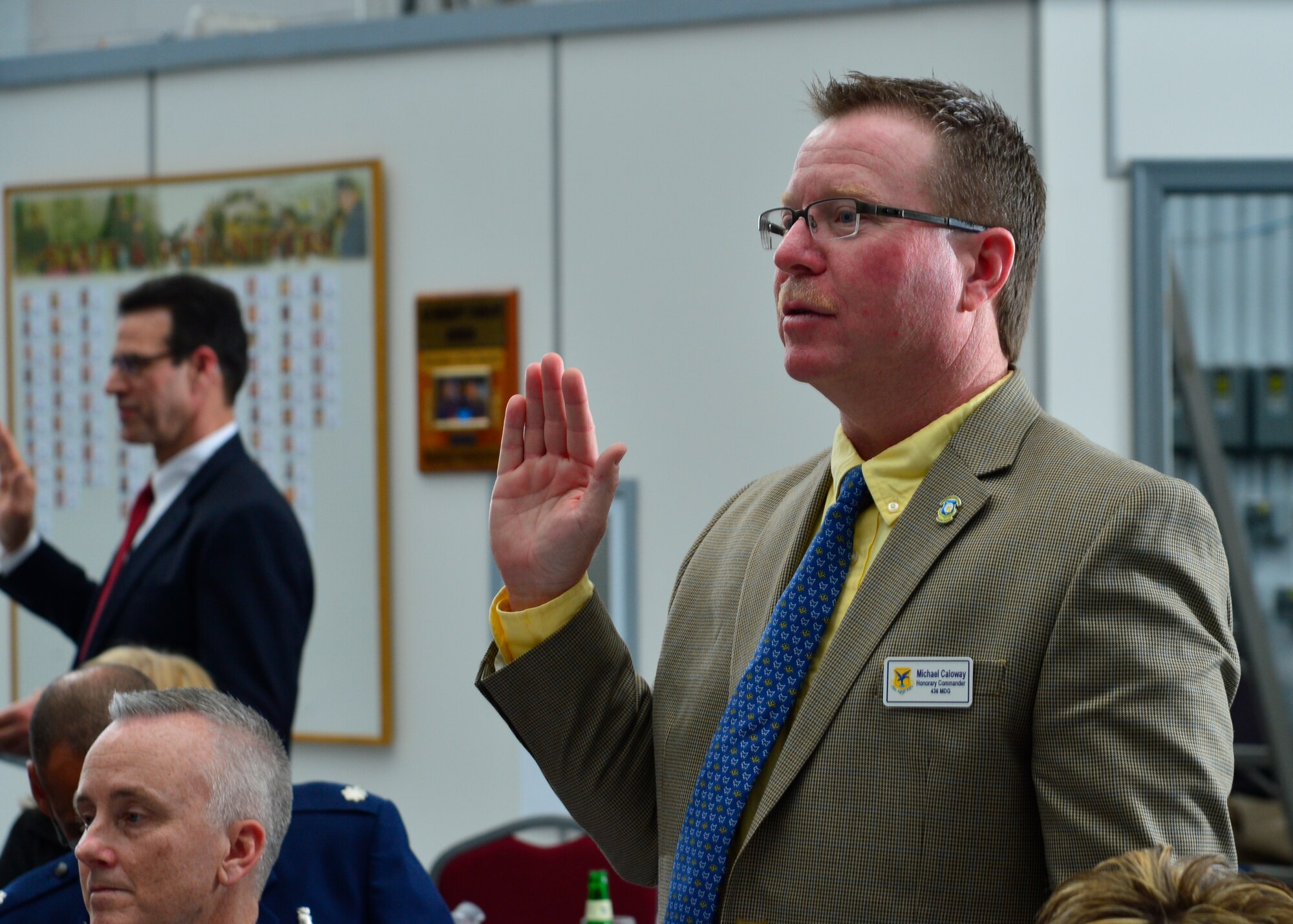 Michael Caloway, United Electric Supply, Inc. director of sales and operations manager, recites an oath during the 2015 Honorary Commander Induction Ceremony Feb. 7, 2015, at the Air Mobility Command Museum, Del. Caloway was inducted as the 436th Medical Group honorary commander. (U.S. Air Force photo/Airman 1st Class William Johnson) 