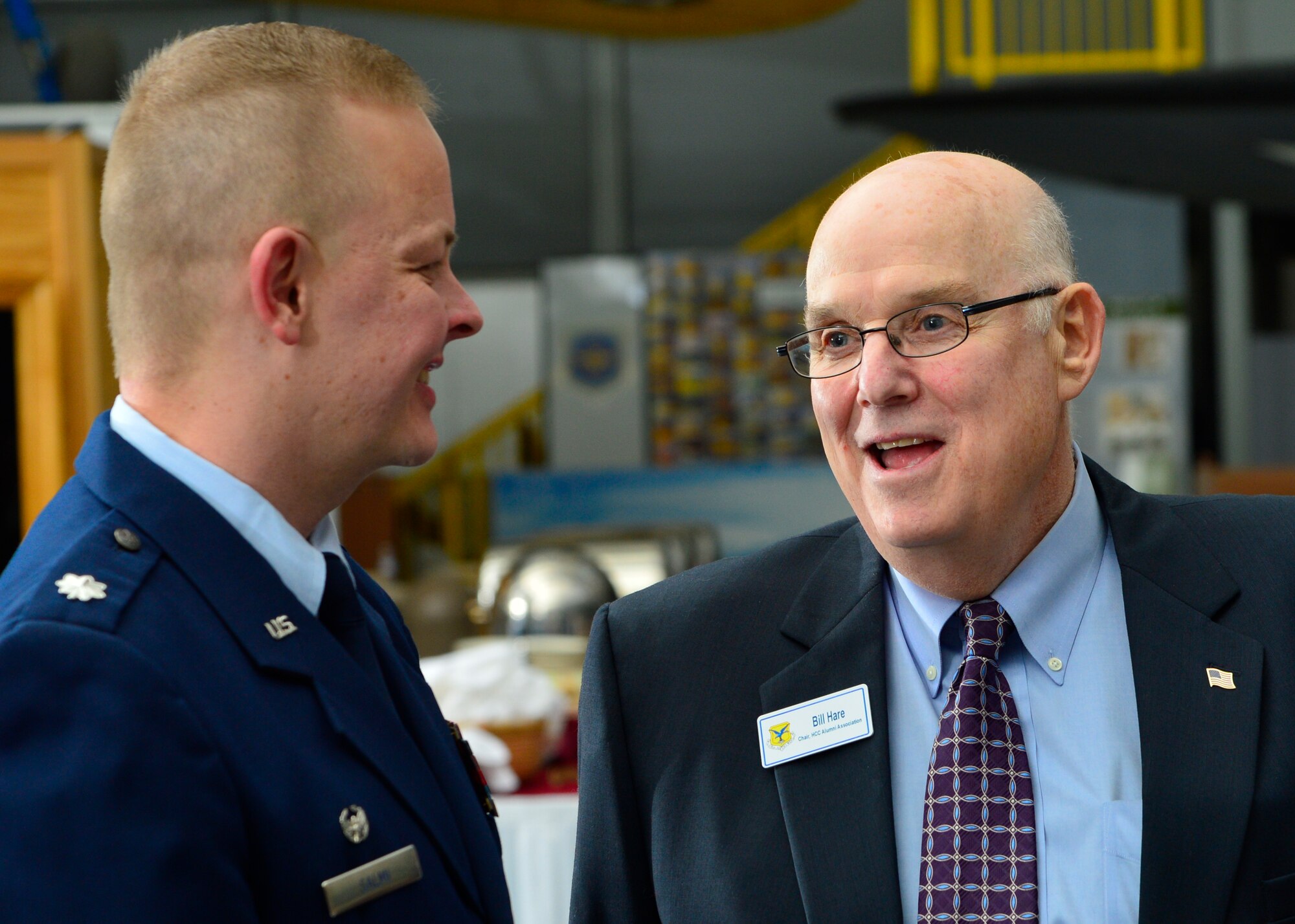 Lt. Col. Derek Salmi, 436th Operations Support Squadron commander, speaks with  Councilman Bill Hare, Dover City Council member, at the 2015 Honorary Commander Induction Ceremony Feb. 7, 2015, at the Air Mobility Command Museum, Del. Hare works closely with the Dover AFB Deployed Spouses program and served as a 2011 Honorary Commander for the 436th Communications Squadron and in 2012 for the 436th OSS. (U.S. Air Force photo/Airman 1st Class William Johnson) 