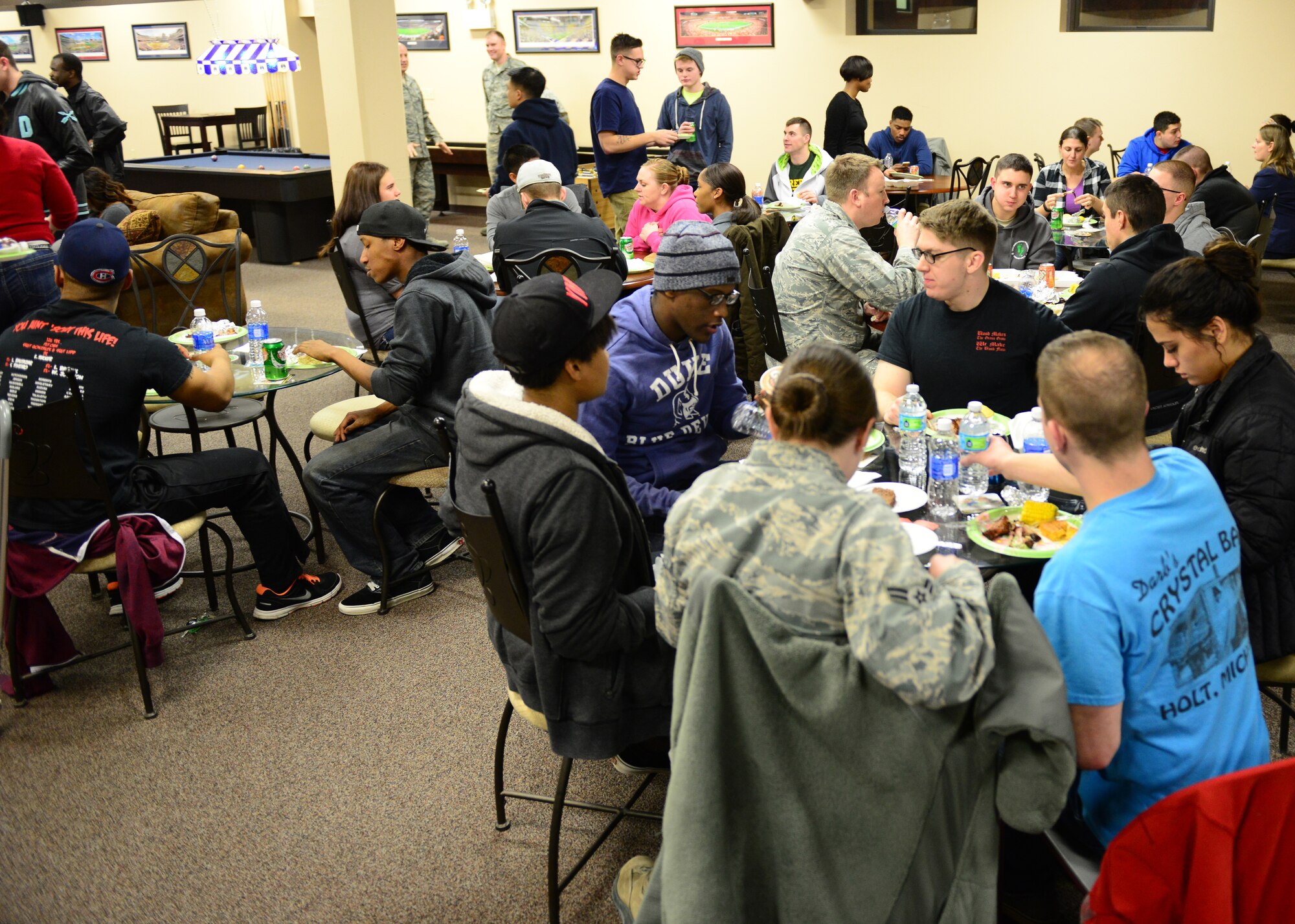 Airmen enjoy a meal at the Icebox in building 2266 during an Airman's Dinner at Eielson Air Force Base, Alaska, Jan. 20, 2015. (U.S. Air Force photo by Senior Airman Ashley Nicole Taylor/Released)