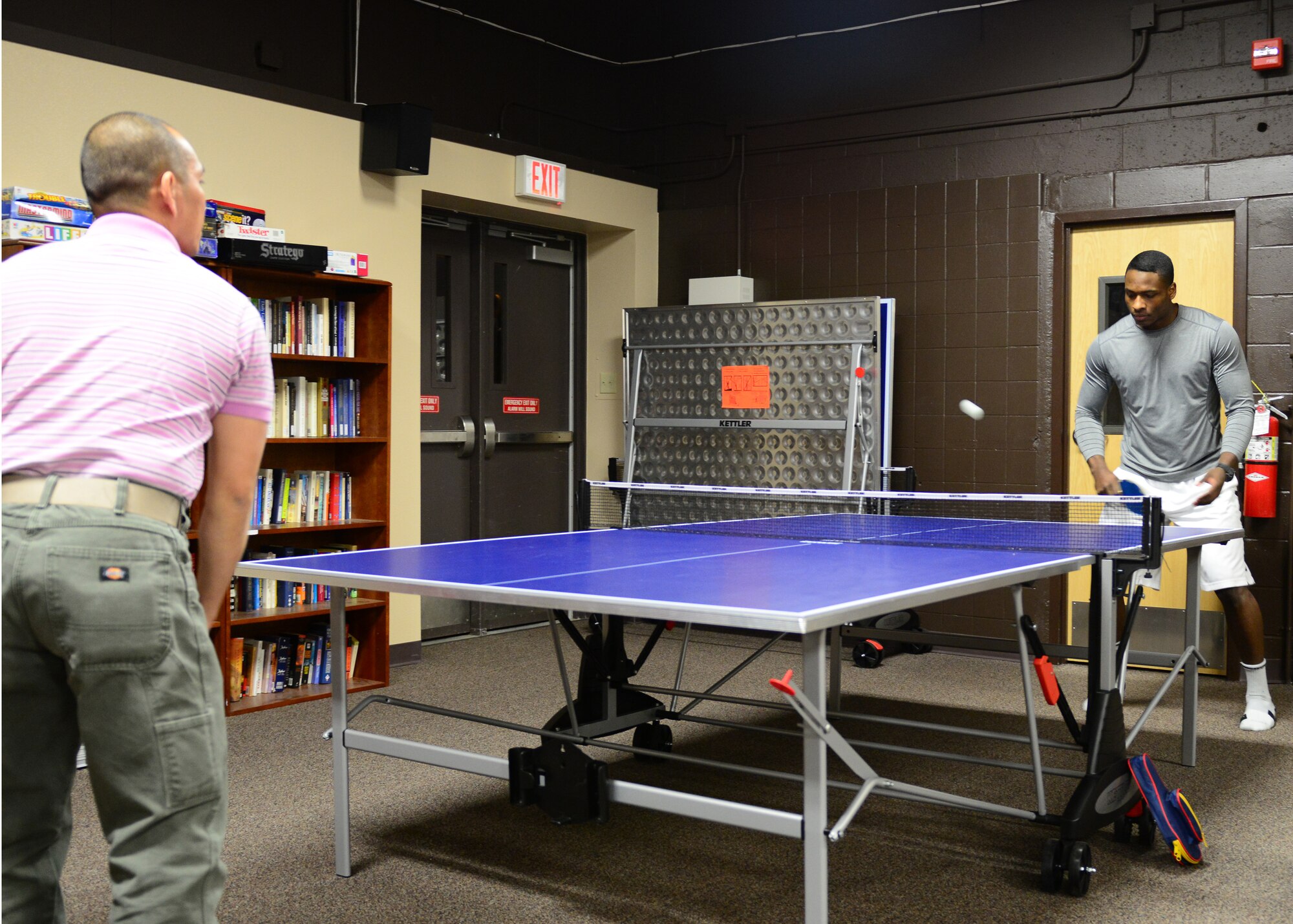 Airmen play a game of ping pong at the Icebox in building 2266 during an Airman's Dinner at Eielson Air Force Base, Alaska, Jan. 20, 2015. (U.S. Air Force photo by Senior Airman Ashley Nicole Taylor/Released)