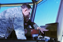 U.S. Air Force Maj. Gen. John N.T. Shanahan, 25th Air Force commander, observes the bird strike avoidance radar system while U.S. Air Force Lt. Col. Alessandro Bruzzano, 55th Wing Safety flight safety officer, points out its various functions inside the air traffic control tower on Offutt Air Force Base, Neb., Jan. 27. The bird radar not only allows personnel to identify when birds become a hazard to aircraft, it also helps shape their knowledge of the threat their aircraft face, and allows the wing to fly more hours every year, with less risk. (U.S. Air Force Photo by Charles Haymond/Released)