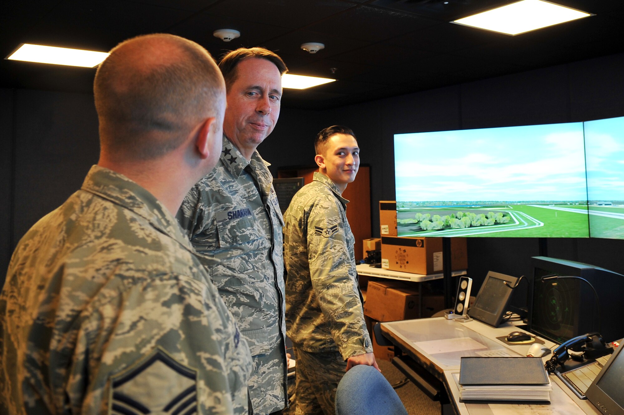 U.S. Air Force Master Sgt. Thomas Cohee, 55th Operations Support Squadron assistant chief controller, gives U.S. Maj. Gen. John N.T. Shanahan, 25th Air Force commander, a briefing inside the air traffic control tower on Offutt Air Force Base, Neb., Jan. 27. Shanahan visited several facilities, met with multiple Airmen and held an all-call during his visit to Offutt. (U.S. Air Force photo by Charles Haymond/Released)