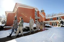 Members of Team Offutt leave the confines of the SAC Chapel located near the historic parade grounds for a Walk for Awareness, Feb. 6, Offutt Air Force Base, Neb. The event marked the official kickoff for a year of diversity awareness events that will both inform and educate Airmen on the importance of Diversity 360. (U.S. Air Force photo by Josh Plueger/Released)