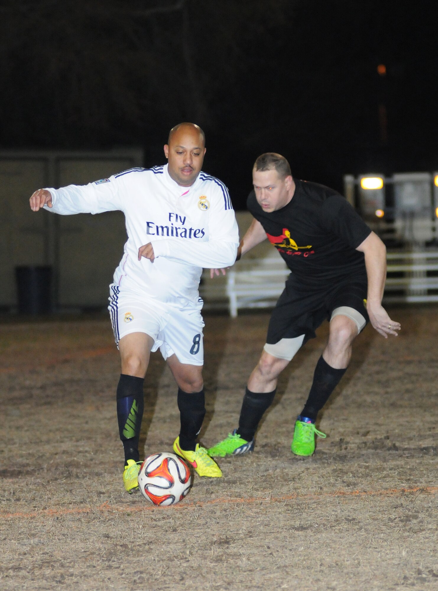 Tarik Romany, 81st Surgical Operations Squadron, dribbles the ball as Joseph Neff, 333rd Training Squadron A team, closes in during the intramural soccer conference championship game Feb. 5, 2015, at Keesler Air Force Base, Miss. The 81st MSGS defeated 333rd TRS A team, 3-2. The 81st MSGS was the La Liga League champion while the 333rd TRS A team was the Premier League champion. (U.S. Air Force photo by Kemberly Groue)