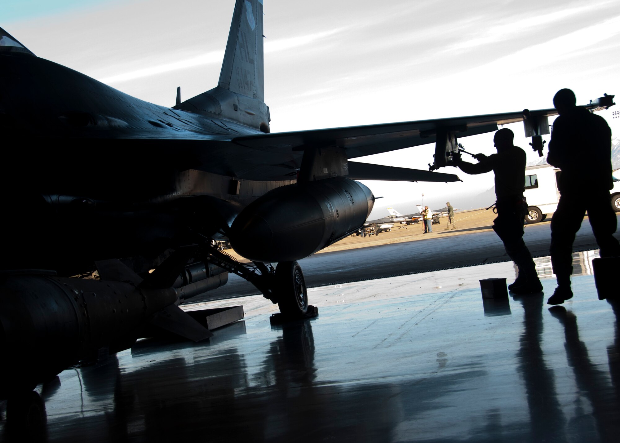Reservists from the 466th Aircraft Maintenance Unit finished first as the weapons load crew of the fourth quarter ahead of the active duty's 4th AMU and 421st AMU Jan. 11, 2015. Every quarter, teams race to load weapons onto F-16s, then compete for the yearly title in February. Two teams from the 421st AMU and one team from the 466th AMU will compete Feb. 13, 2015 in Hangar 37 to determine which team will be named, "Weapons Load Crew of the Year." (U.S. Air Force photo/Staff Sgt. Christina Judd)