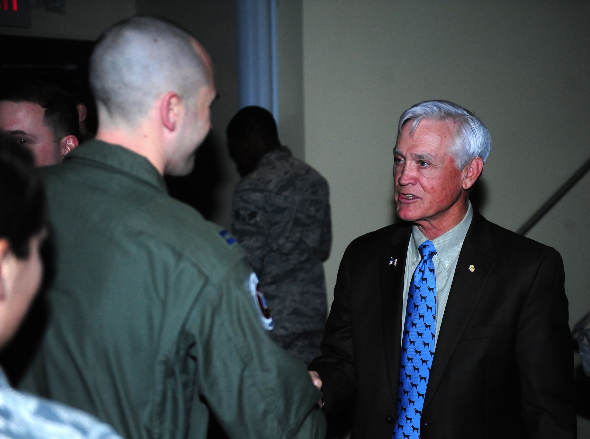 Retired Lt. Col. Barry Bridger, a Vietnam veteran, prisoner of war, and former member of Seymour Johnson Air Force Base, North Carolina, shakes hands with Airmen during the 4th Fighter Wing’s Leadership Lecture Series, Feb. 4, 2014, at Seymour Johnson AFB. During the Vietnam War, on Jan. 23, 1967, Bridger was shot down by a surface-to-air missile in his F-4 Phantom. The damage sent him and his wingman into a spiral from which they had to eject from their aircraft. He was quickly captured and transported to the Hanoi Hilton prison camp where he spent six years of his life. (U.S. Air Force photo/Airman 1st Class Brittain Crolley)