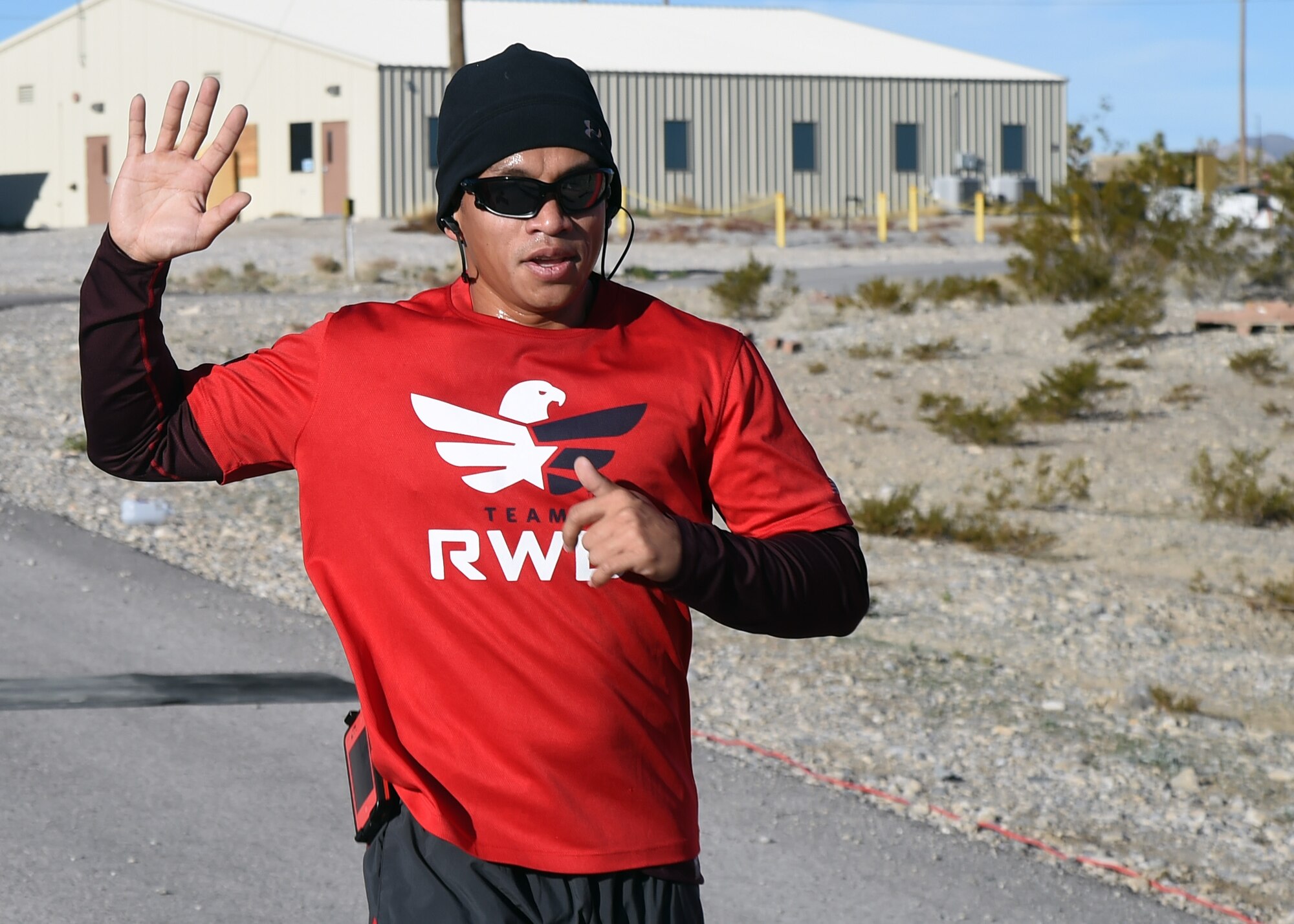 Staff Sgt. Richard Quino Jr, 799th Air Base Squadron vehicle maintainer, crosses the finish line of the 99th Ground Combat Training Squadron’s final 5K run Feb. 4, 2014 at Silver Flag Alpha training range. The 5K was one of several events held as part of the 99th GCTS’s draw-down and eventual inactivation, which is slated for March 2015. (U.S. Air Force Photo/Tech. Sgt. Shad Eidson/Released)

