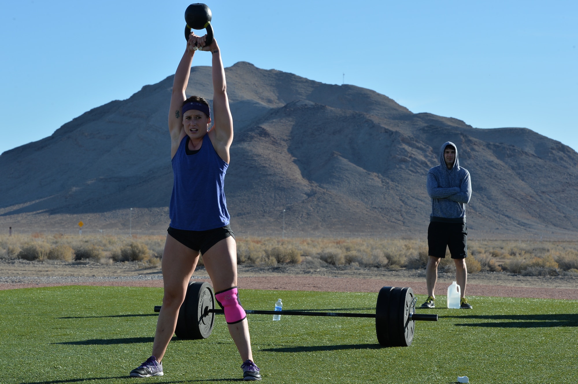 1st Lt. Amber Sikora, 99th Contracting Squadron contracting officer, executes the kettle ball swing during the CrossFit challenge Feb. 3, 2015, at Creech Air Force Base, Nevada. As part of closing the 99th Ground Combat Training Squadron, they received the first Air Combat Command Security Forces Order of the Shield unit award on Feb. 6, 2015. (U.S. Air Force photo by Senior Airman Adarius Petty/Released)