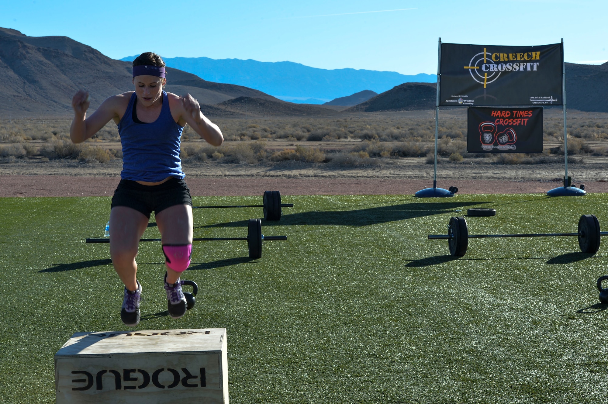 1st Lt. Amber Sikora, 99th Contracting Squadron contracting officer, performs box jumps on Feb. 3, 2015, at Creech Air Force Base, Nevada. The CrossFit challenge was held for the closing of the 99th Ground Combat Training Squadron. As part of closing the 99th Ground Combat Training Squadron, they received the first Air Combat Command Security Forces Order of the Shield unit award on Feb. 6, 2015. (U.S. Air Force photo by Senior Airman Adarius Petty/Released