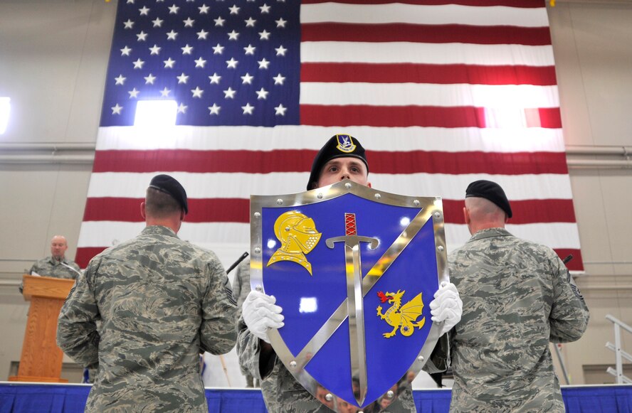 The Order of the Shield Detail presents the shield to the honor flights and attendees during an Air Combat Command Security Forces Order of the Shield ceremony Feb. 6, 2015, at Creech Air Force Base, Nevada. The shield represents the defenders as the true shield of protection against attacks, and recognizes them for their contributions to security forces within ACC. (U.S. Air Force photo by Airman 1st Class Christian Clausen/Released)