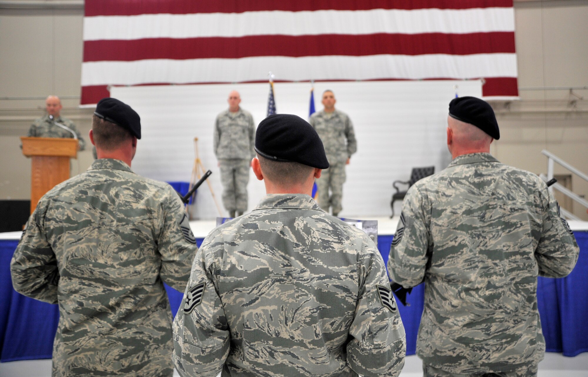 The Order of the Shield Detail presents the shield to Col. Erik Rundquist, chief of security forces, Headquarters Air Combat Command, left, and Maj. Jesse Goens, 99th Ground Combat Training Squadron commander during the ACC Security Forces Order of the Shield ceremony Feb. 6, 2015, at Creech Air Force Base, Nevada. The 99th GCTS became the first unit to receive the award to date. The squadron is slated for inactivation March 2015. (U.S. Air Force photo by Airman 1st Class Christian Clausen/Released)