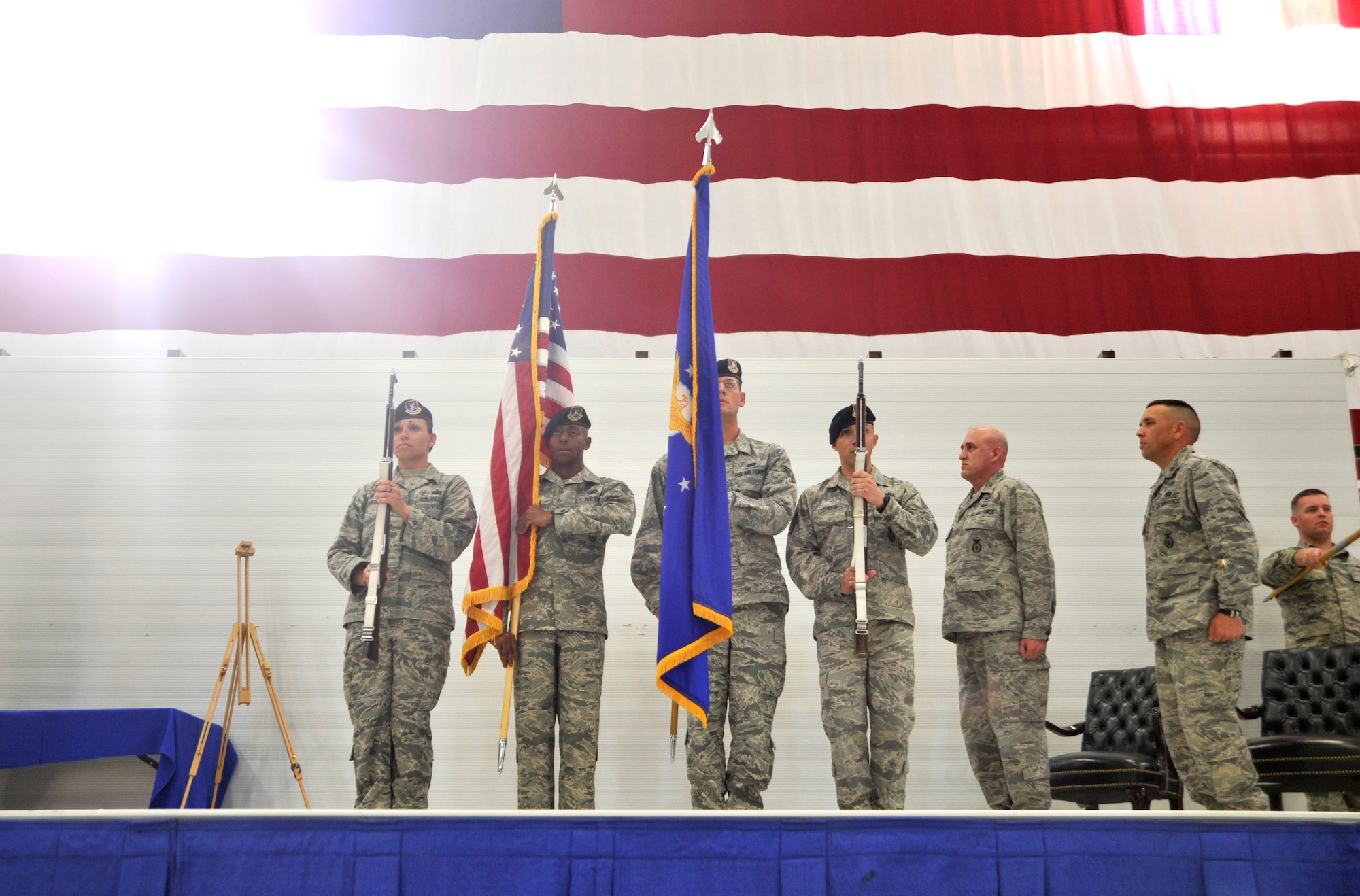 The 99th Ground Combat Training Squadron members present the colors during an Air Combat Command Security Forces Order of the Shield ceremony Feb. 6, 2015, at Creech Air Force Base, Nevada. The 99th GCTS is the first unit to receive the award which recognizes individuals or ACC units who have made significant contributions to security, training, and ground defense of ACC installations, missions, personnel, and resources. (U.S. Air Force photo by Airman 1st Class Christian Clausen/Released)