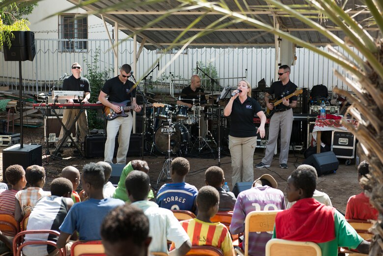 DJIBOUTI -- The U.S. Air Forces in Europe Band, rock ensemble Touch n’ Go, plays for local children at eh Caritas Center in Djibouti Feb. 8, 2015. The band was performing community outreach concerts while traveling with African Partnership Flight-Djibouti, a program to strengthen relationships among East African nations. (U.S. Air Force photo/Tech. Sgt. Benjamin Wilson)