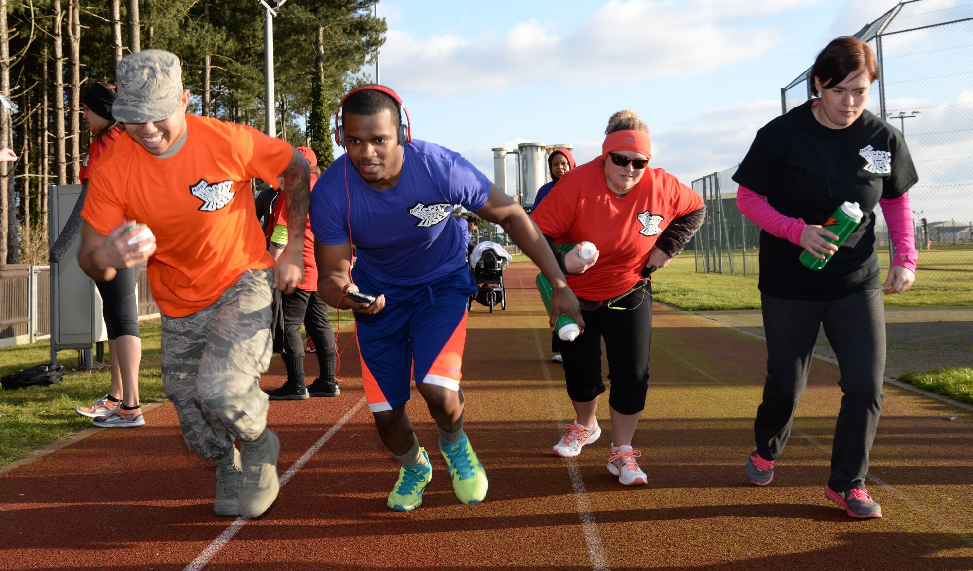 Team Mildenhall members push off the starting line of a relay race Feb. 6, 2015, at Heritage Park on RAF Mildenhall, England. The relay race was the first competition held for the Biggest Loser program. (U.S. Air Force photo by Airman 1st Class Jonathan Light/Released)