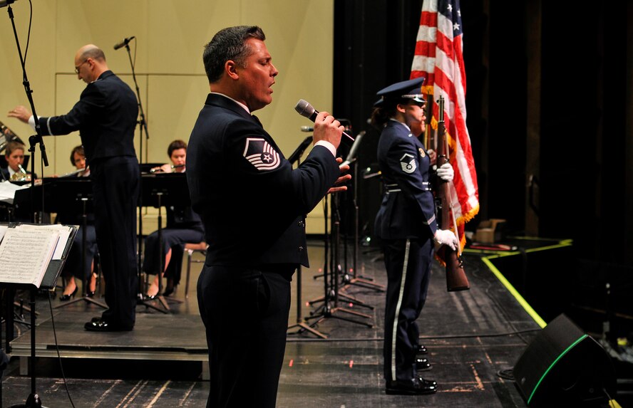 U.S. Air Force Master Sgt. Douglas A. Mattsey, an instrumentalist with the 566th Air Force Band, sings "The Star-Spangled Banner" at the Illinois Music Educators Association conference opening night in Peoria, Ill., Jan. 28, 2015. The 566 AFB serves in war and peace by preserving national heritage through the power of music at military, recruiting and community relations events. (U.S. Air National Guard photo by Staff Sgt. Lealan Buehrer/Released)