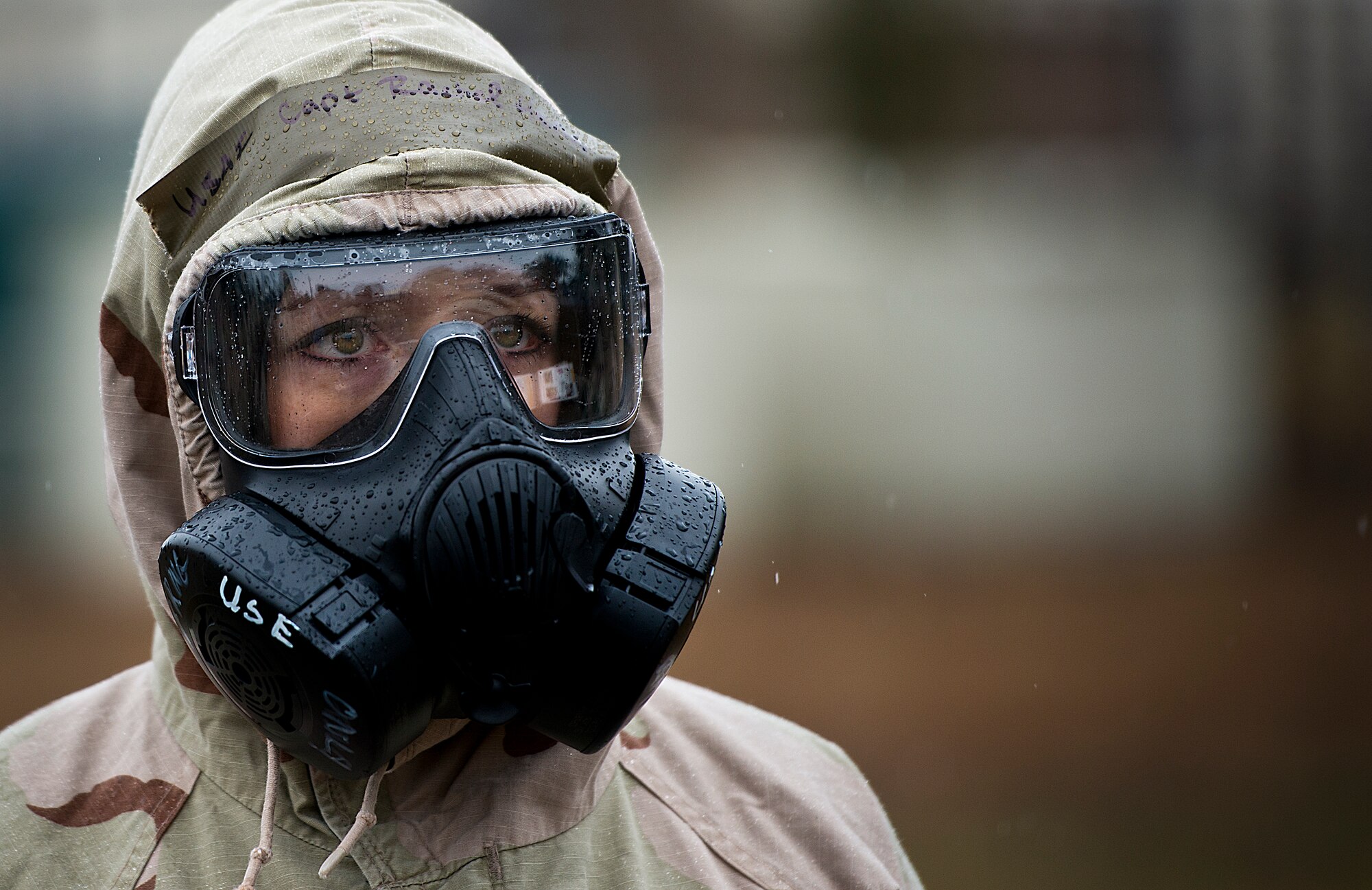 Capt. Rachel Henn, 96th Medical Group, stands in the rain during a Phase II readiness exercise Feb. 4 at Eglin Air Force Base, Fla. A Phase II evaluates an Airman’s ability to meet wartime and contingency taskings of employing and sustaining the force and the ability to survive and operate. More than 30 potential deployers received classroom and practical field training during the exercise. (U.S. Air Force photo/Samuel King Jr.) 