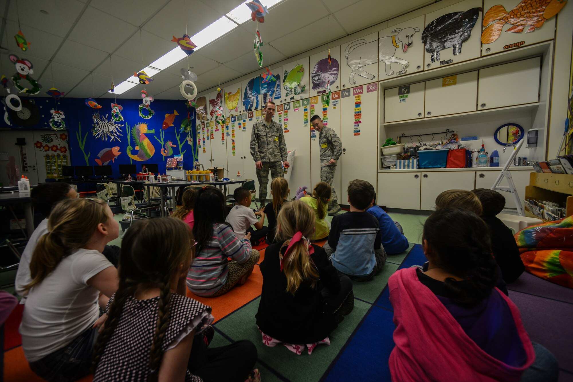 Capt. Mark Stevenson and Airman 1st Class Alvin Hsieh, 86th Dental Squadron dentist and dental assistant, teach a class on dental hygiene to student at Ramstein Air Base, Germany, Feb.  6, 2014. The 86th Dental Squadron visits Ramstein Elementary School annually during Children’s Dental Health Month. (U.S. Air Force photo/Senior Airman Nicole Sikorski)