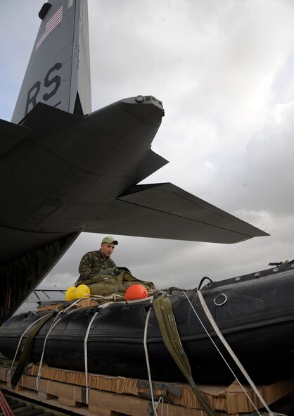 A Hellenic air force Airman does a final inspection on a Greek-configured boat rig before it is loaded onto a C-130J Super Hercules assigned to the 37th AS in Elefsis, Greece, Feb. 6, 2015. The rig was prepared to be dropped from the C-130 during Stolen Cerberus II, a flying training deployment designed to gauge the capabilities of personnel and aircraft as well as increase the interoperability between the U.S. and one of its NATO allies. (U.S. Air Force photo/Senior Airman Timothy Moore)