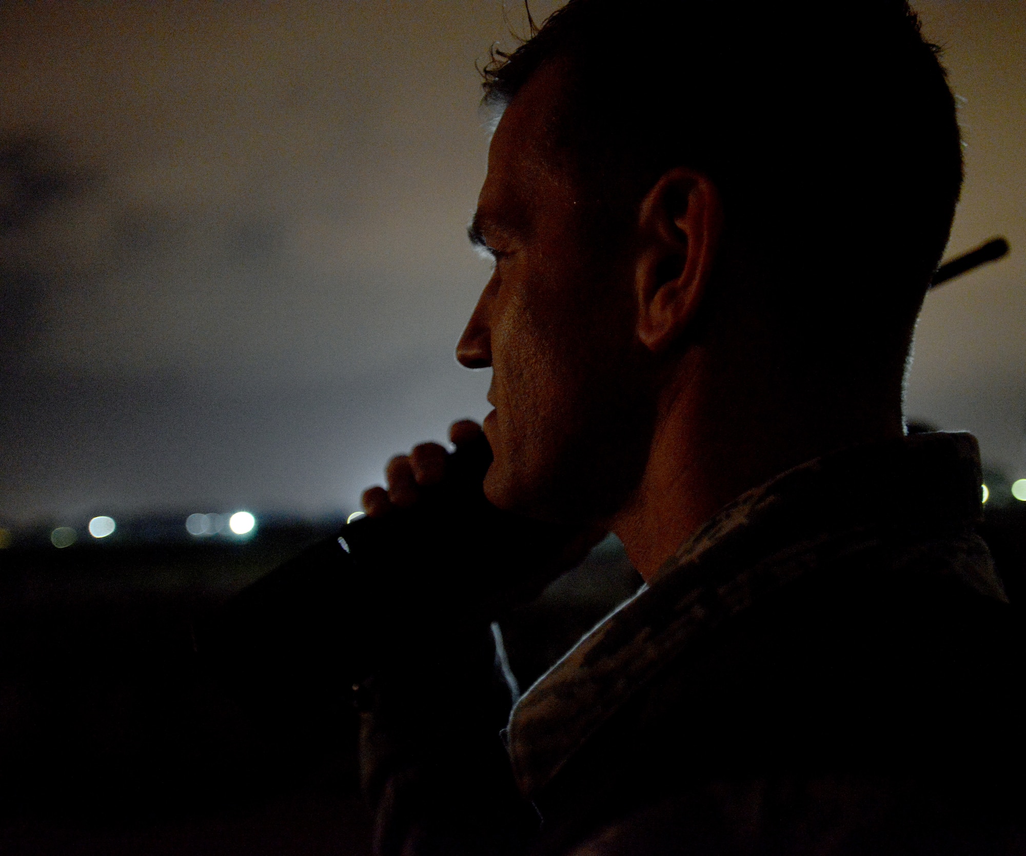 Master Sgt. David Hough, 435th Air Mobility Squadron contingency airfield manager, speaks to the crew of a C-130J Super Hercules as it approaches a runway in Elefsis, Greece, Feb. 5, 2015. The 435th Air Ground Operations Wing's Contingency Response Group is implementing a new landing zone program that will allow members of CRGs prepare landing zone operations from picking the location to actually providing limited air traffic control. (U.S. Air Force photo/Senior Airman Timothy Moore)
