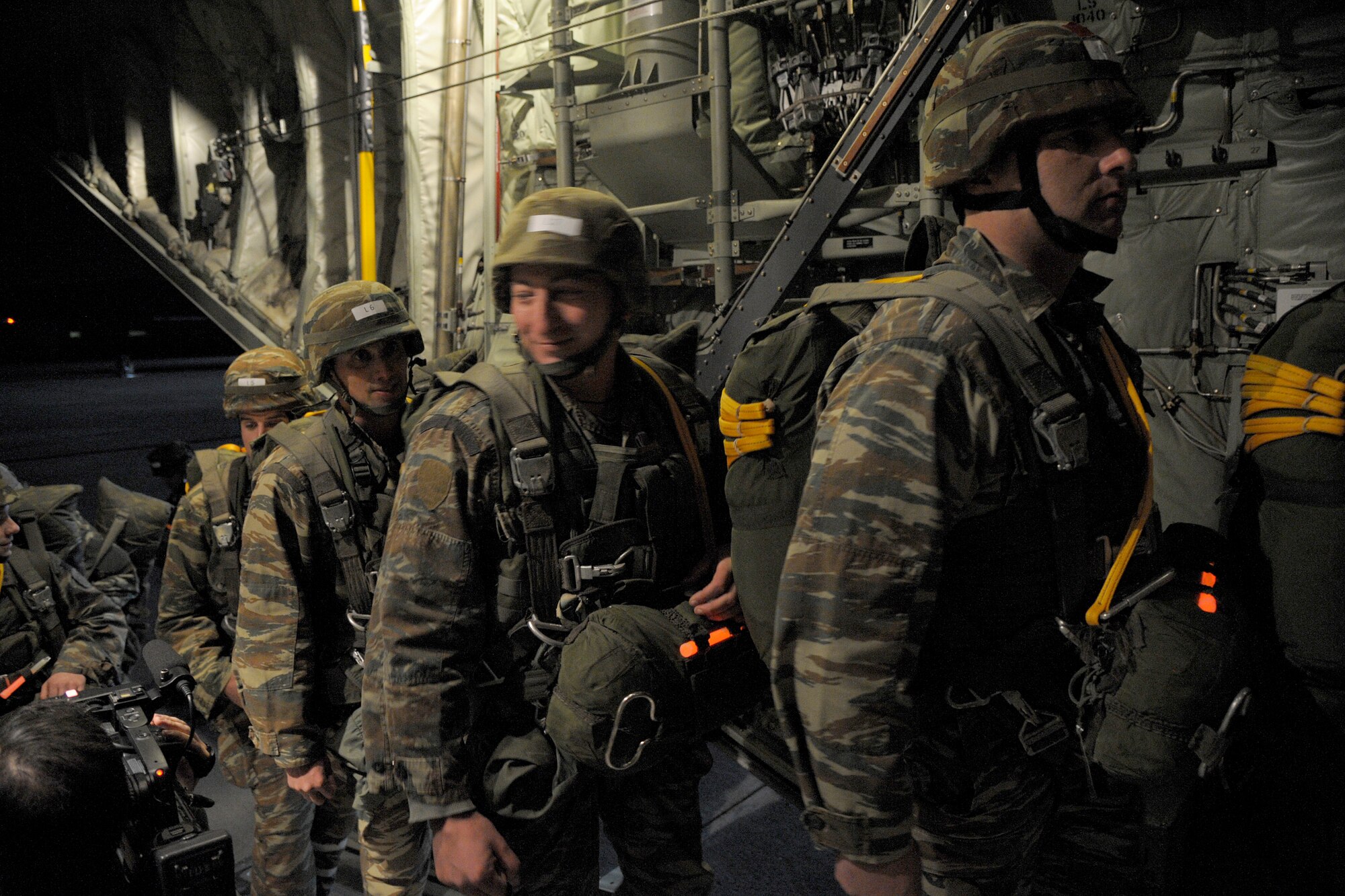 Greek paratroopers board a C-130J Super Hercules assigned to the 37th Airlift Squadron during Stolen Cerberus II, a flying training deployment in Elefsis, Greece, Feb. 4, 2015. The FTD is designed to improve the interoperability of the U.S. and Greek Air Forces. It is being held from Feb. 2 to 14. (U.S. Air Force photo/Senior Airman Timothy Moore)