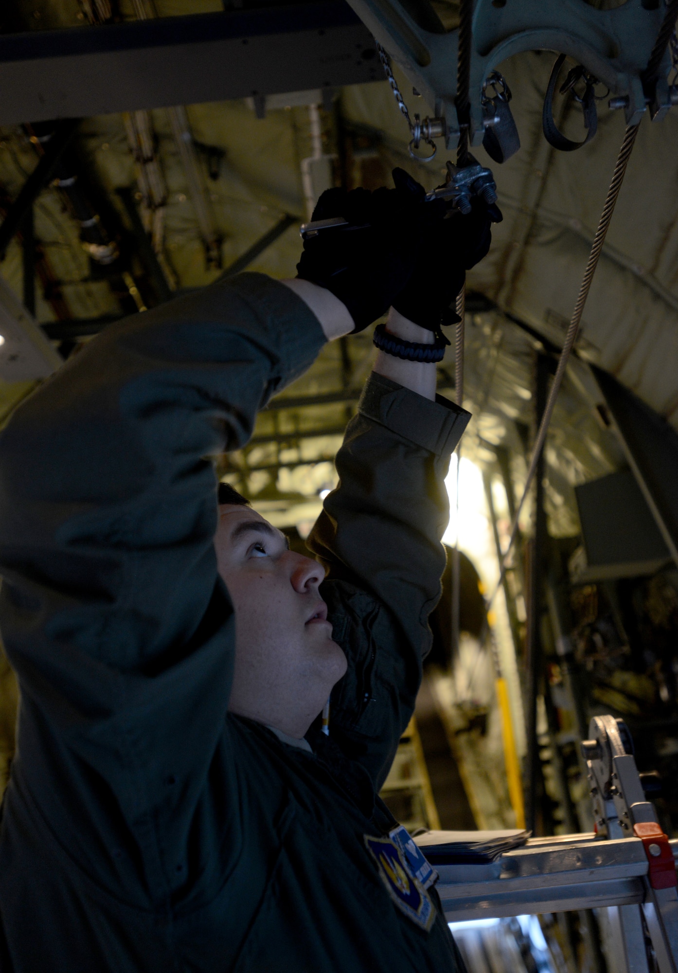 Staff Sgt. Joshua Nelson, 37th Airlift Squadron loadmaster, secures a line on a C-130J Super Hercules before a night flight during the Stolen Cerberus II flying training deployment. The FTD is designed to improve the interoperability of the U.S. and Greek Air Forces. It is being held from Feb. 2 to 14. (U.S. Air Force photo/Senior Airman Timothy Moore)