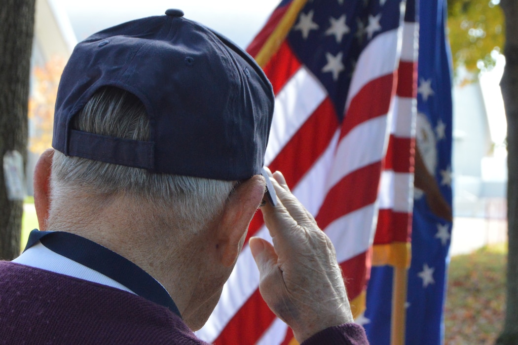 A veteran salutes the US Flag