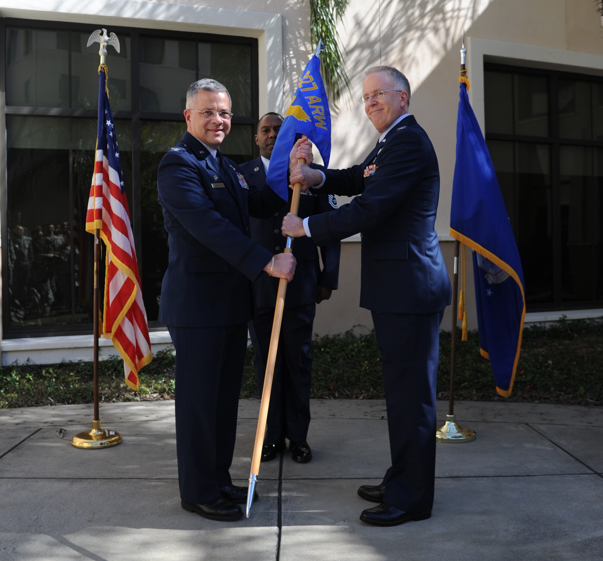 Colonel (Dr.) Gregory L. Candell assumed command of the 927th Aerospace Medical Squadron in an assumption of command ceremony held here, Feb. 8. On left Col. Randal Bright 927th Air Refueling Wing Commander passes the 927th AMDS guidon to Colonel (Dr.) Gregory L. Candell. (U.S. Air Force photo/Tech. Sgt. Peter Dean)