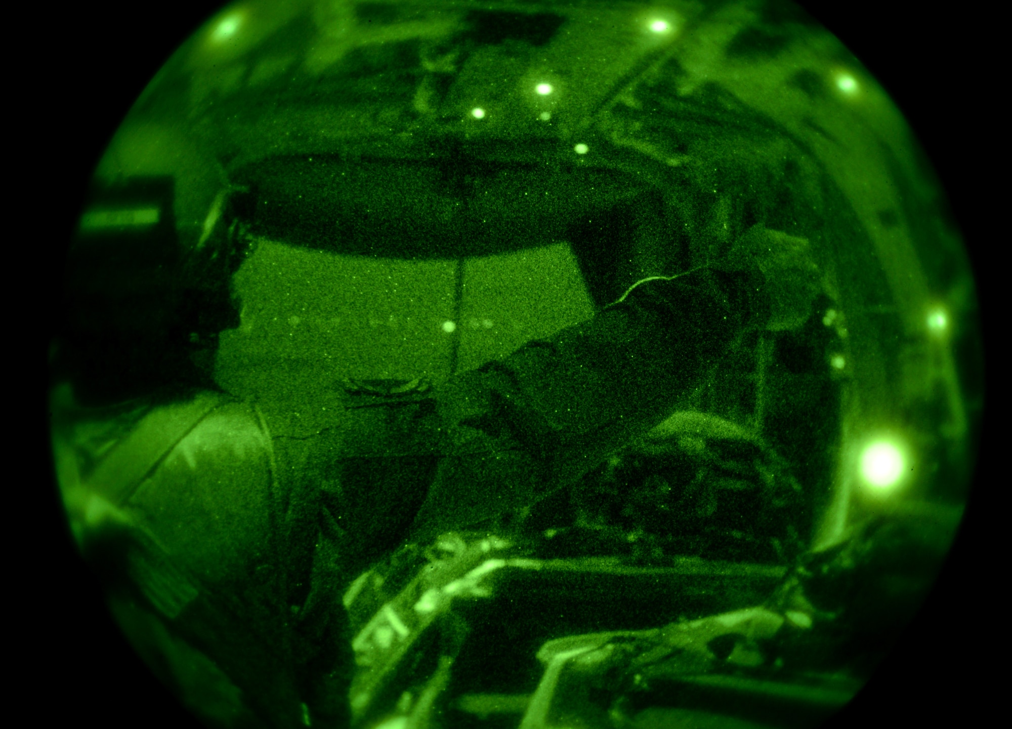 U.S. Air Force Master Sgt. Raymond Beasley, 67th Special Operations Squadron MC-130J Commando II loadmaster from Shalimar, Fla., gives a thumbs-up to begin a heavy equipment drop during training Jan. 22, 2015, over RAF Sculthorpe, England. Necessary when entering potentially hazardous areas, Air Commandos must hit their target drop zone to resupply special operations forces via airdrop. These require careful planning to ensure even weight distribution and strategic placement of cargo for the quickest, most accurate deployment of supplies. (U.S. Air Force photo by Senior Airman Kate Maurer/Released)
