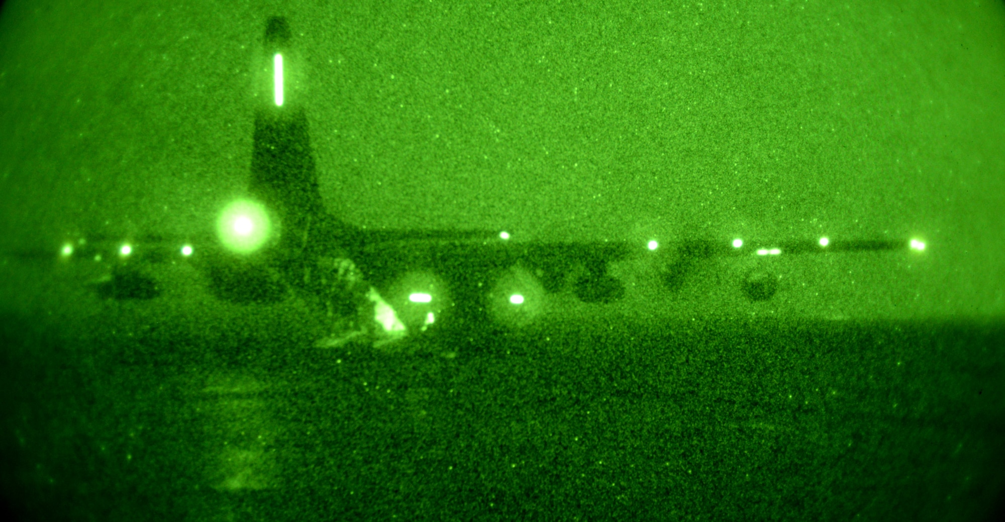 An M C-130J Commando II sits on a taxiway during Forward Area Refueling Point Training Jan. 21, 2015, at RAF Sculthorpe, England. A FARP involves landing the MC-130J Commando II with fuel technicians ready, night-vision goggles donned and hoses prepped. The technicians and loadmaster then quickly exit the aircraft, attach the hose to the fuel tank and pull yards of remaining hose to a safe distance while awaiting incoming aircraft, such as a CV-22 Osprey. (U.S. Air Force photo by Senior Airman Kate Maurer/Released)