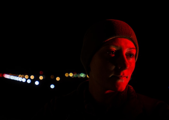 Senior Airman Kathryn Raethel, 437th Operations Support Squadron Airfield Management technician, drives the entire length of the flight line during her night shifts, looking for any damaged or burnt out runway lights as well as directional signs used by aircraft Feb. 9, 2015, at Joint Base Charleston, S.C. Whenever an in-flight emergency occurs, the Base Operations office is notified and begins informing several different agencies to handle the delicate situation. (U.S. Air Force photo/ Senior Airman Dennis Sloan)
