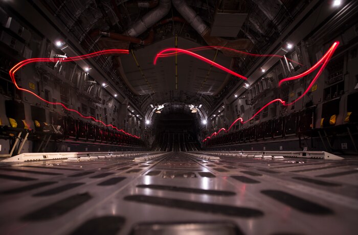A camera using a slow shutter speed captures the light from flashlight Airmen from the 437th Operations Support Squadron use to inspect equipment inside a C-17 Globemaster III Feb. 9, 2015, at Joint Base Charleston, S.C. AFE works through the night to provide aircrew members with safe and reliable equipment, including night vision goggles, helmets, masks and even parachutes.  (U.S. Air Force photo/ Senior Airman Dennis Sloan)