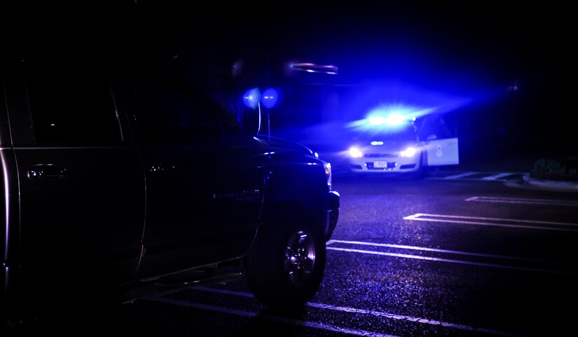 A 628th Security Forces Squadron patrolman performs a training exercise Feb. 8, 2015, on Joint Base Charleston, S.C. Patrolmen go throughout the night patrolling the base on the search for anything suspicious or out of the ordinary  while keeping the streets safe of any dangerous activity. (U.S. Air Force photo/Airman 1st Class Clayton Cupit)