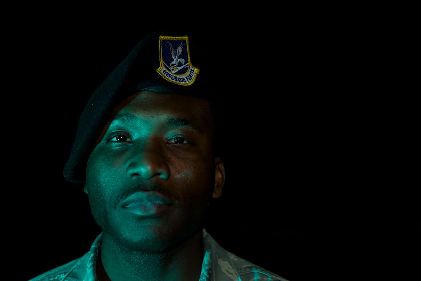Senior Airman Joshua Howard, 628th Security Forces Squadron entry controller, stands watch Feb. 8, 2015, at the Rivers Gate on Joint Base Charleston, S.C. Entry controllers are the front line when it comes to base defense and remain vigilant throughout the night to assure the safety of the base assets and personnel. (U.S. Air Force photos/Airman 1st Class Clayton Cupit)