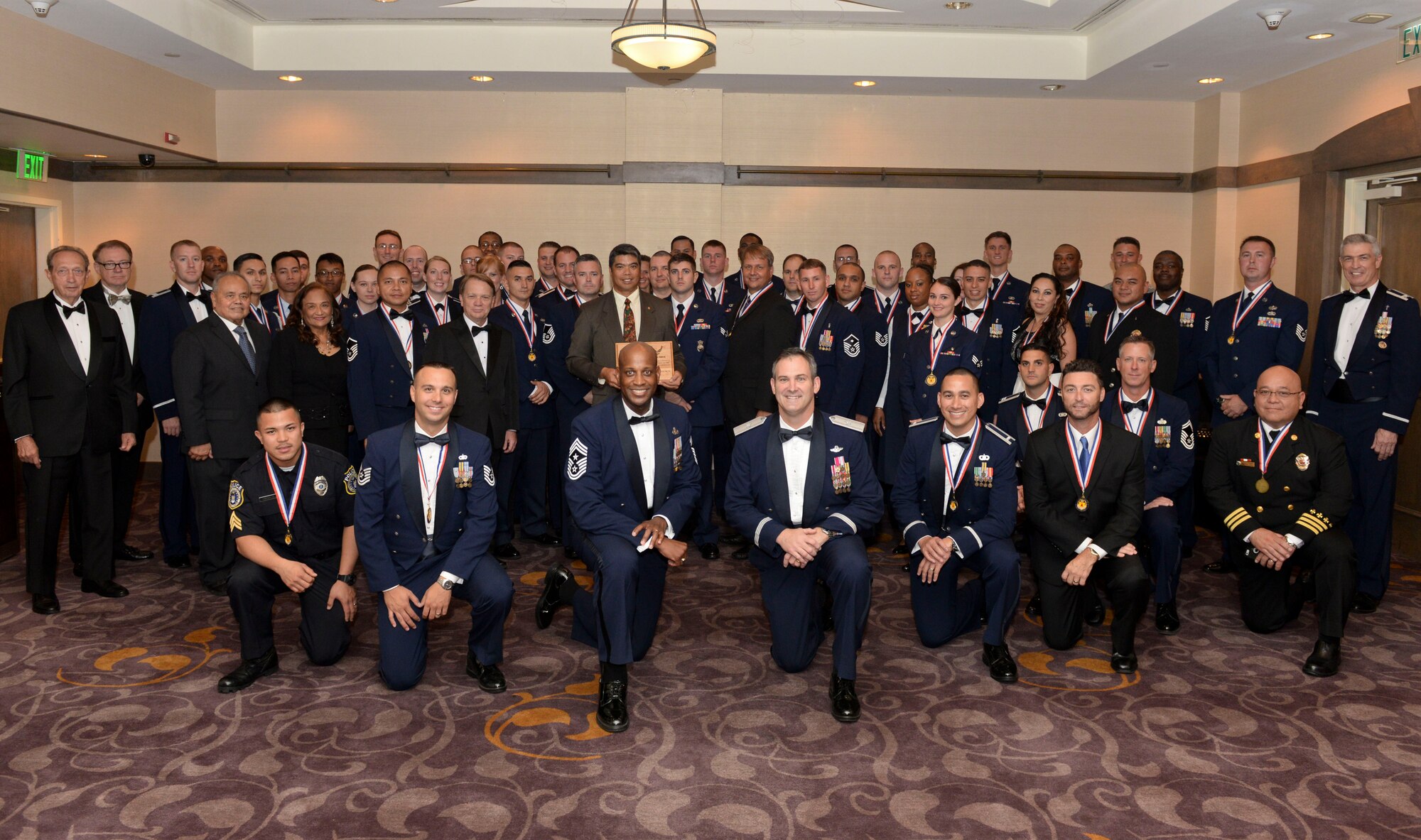 The 36th Group award winners pose for a photo with Brig. Gen. Andrew Toth, 36th Wing commander and Chief Master Sgt. Michael McMillan, 36th Wing command chief, before the Annual Awards Banquet Feb. 6, 2015, in Tumon, Guam. ( U.S. Air Force photo by Staff Sgt. Robert Hicks/Released)  