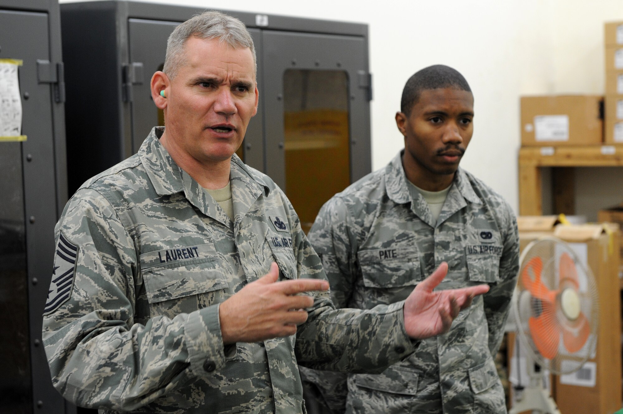 U.S. Air Force Chief Master Sgt. James Laurent, 5th Air Force command chief master sergeant, asks questions about maintenance equipment for the 18th Logistics Readiness Squadron on Kadena Air Base, Japan, Feb. 5, 2015. During his visit Laurent met with Airmen at the different squadrons on Kadena to gain a better understanding of the mission here. (U.S. Air Force photo by Airman 1st Class Stephen G. Eigel)