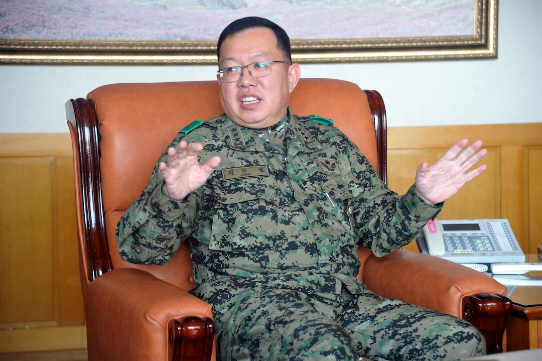 South Korean Army Lt. Gen. Chun In-bum, left, commander of the South Korean Special Warfare Command, talks with U.S. Marine Corps Sgt. Maj. Bryan Battaglia, senior enlisted advisor to the chairman of the Joint Chiefs of Staff, along with U.S. Army Command Sgt. Maj. John Troxell, senior enlisted advisor to U.S. Forces Korea and South Korean Command Sgt. Maj. Lee Gil-ho during an office call in Seongnam, South Korea, Feb. 6, 2015.