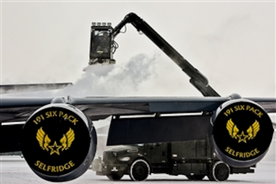 An Air National Guard crew chief de-ices a KC-135 Stratotanker on Selfridge Air National Guard Base in Harrison Township, Mich., Feb. 4, 2015. The crew chief is assigned to the 191st Air Refueling Group. 
