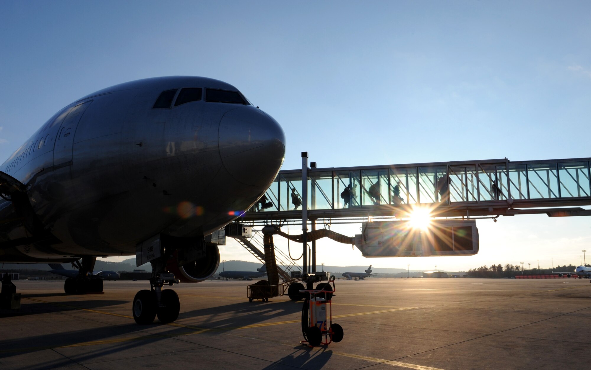 Passengers arriving from Baltimore-Washington International Airport depart an aircraft upon arrival at the Passenger Terminal at Ramstein Air Base, Germany, Feb. 4, 2015. The passenger terminal serves more than 13,000 passengers in an average month. (U.S. Air Force Photo/Airman 1st Class Michael Stuart) 